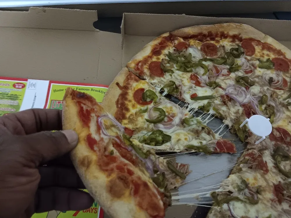 Jumbo Thin Crust Cheese Pizza Red Onions Green Peppers Sausage and Pepperoni